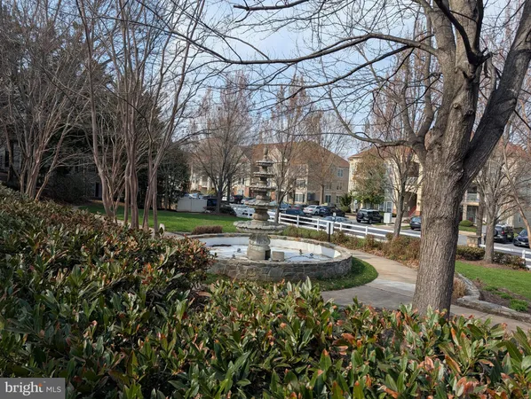 a view of yard with swimming pool and green space