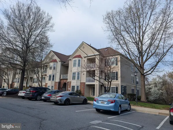 a car parked in front of a brick house