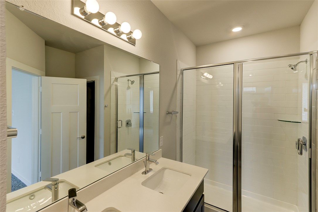 760 Double Mountain Road College Station, TX 77845 - Photo 13 of 26 a bathroom with a sink shower and a mirror