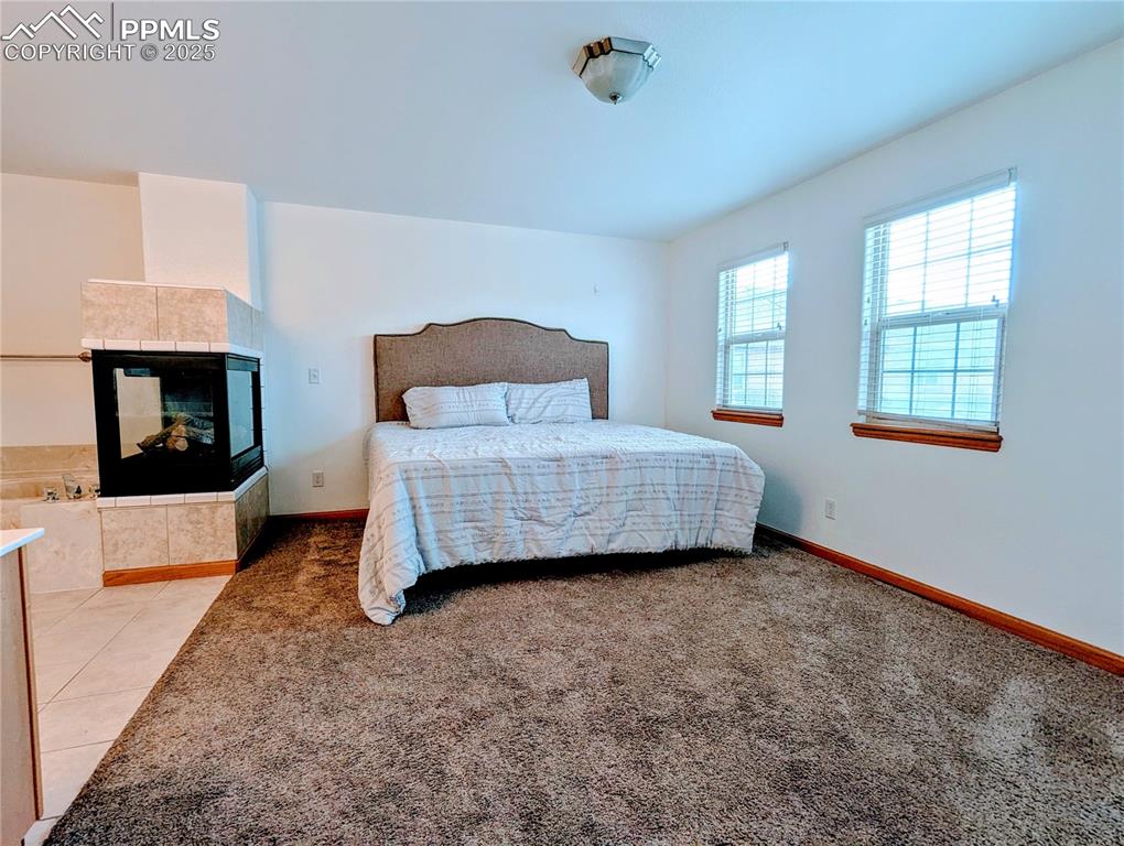 7326 Legacy Point Fountain, CO 80817 - Photo 13 of 18 a bedroom with a bed and a couch