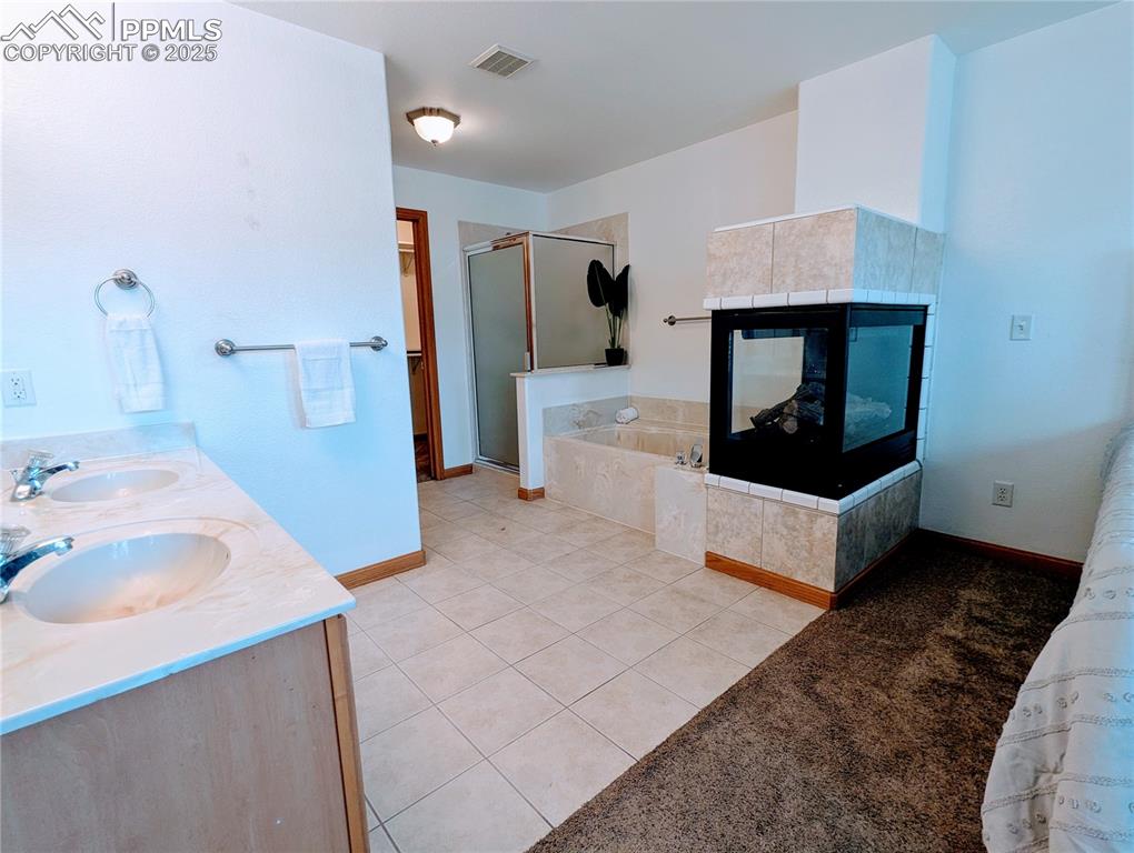 7326 Legacy Point Fountain, CO 80817 - Photo 15 of 18 a bathroom with a sink and a mirror