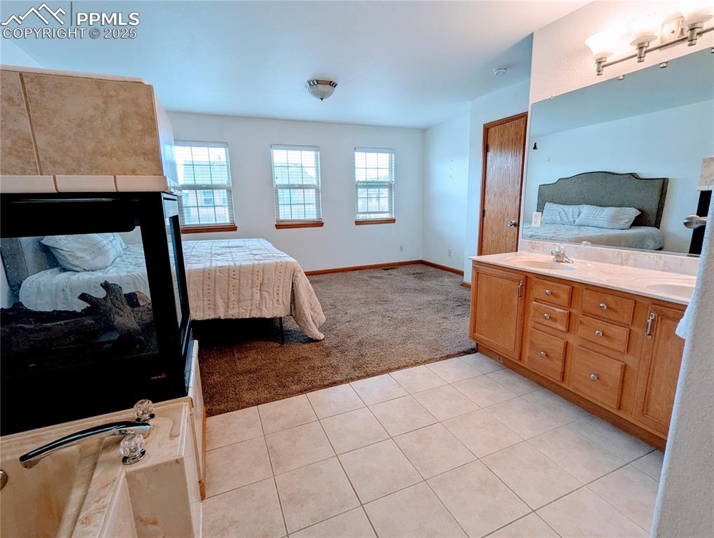 7326 Legacy Point Fountain, CO 80817 - Photo 16 of 18 a bedroom with a bed and a dresser