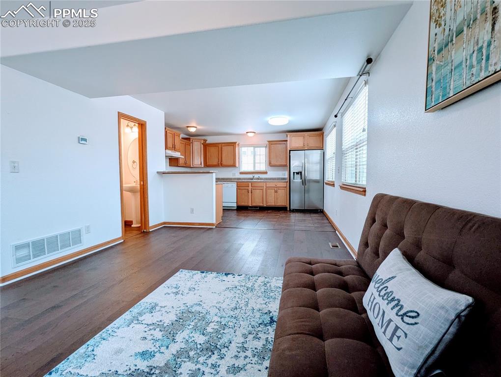 7326 Legacy Point Fountain, CO 80817 - Photo 4 of 18 a living room with furniture and a wooden floor