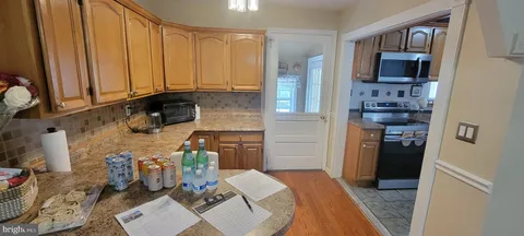 a kitchen with a sink and a stove top oven
