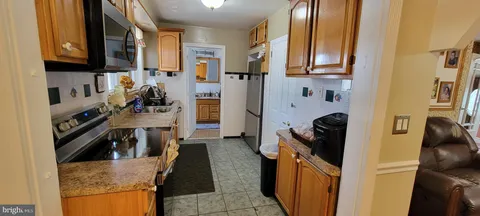 a bedroom with a bed and a mirror