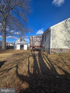 a view of a backyard of the house