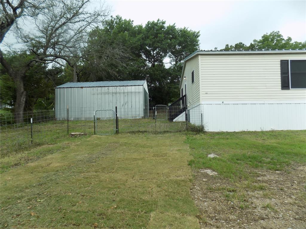 203 South Ridgeview Court Azle, TX 76020 - Photo 18 of 29 Workshop or storage at the back of home.