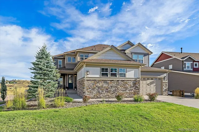 a balcony with furniture and a floor to ceiling window