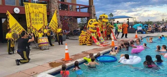 a view of a swimming pool with outdoor seating