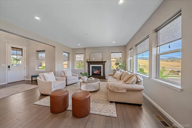 a view of a dining room with furniture window and wooden floor