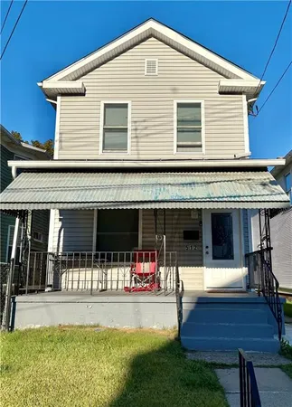 a front view of house with yard