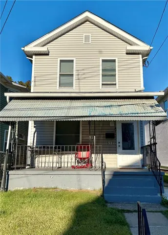 a front view of house with yard