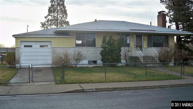 690 Lester Avenue Reno, NV 89502 - Photo 1 of 13 a front view of a house with a garden and yard