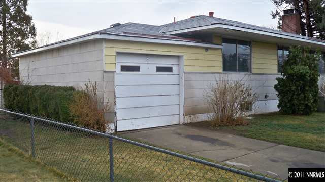 690 Lester Avenue Reno, NV 89502 - Photo 3 of 13 a front view of a house with a yard