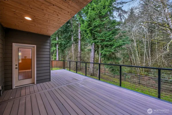 a balcony with view of trees in front of it