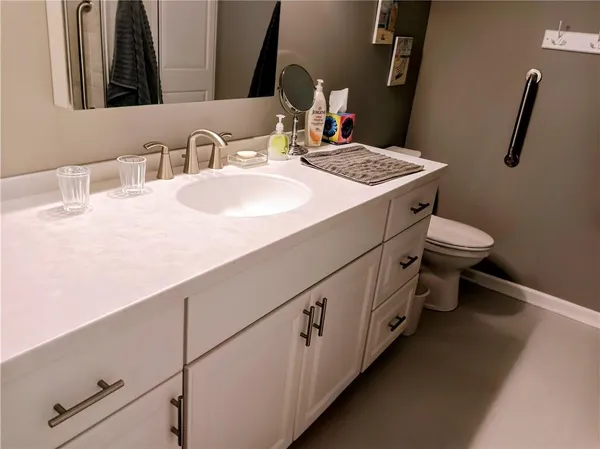 a bathroom with a sink and toilet