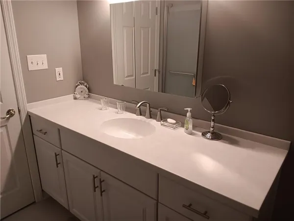 a bathroom with a sink and a mirror