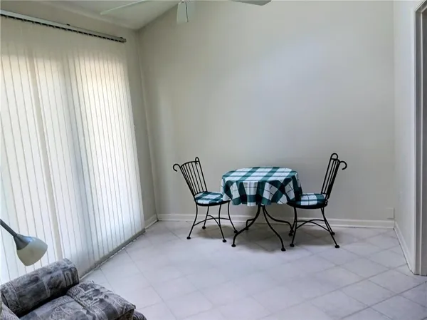 a view of a livingroom with furniture and windows