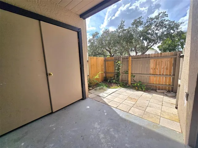 a view of backyard with tub