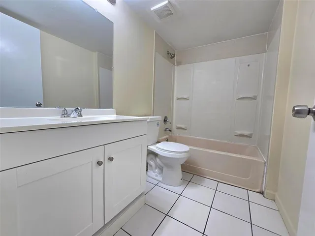 a bathroom with a sink toilet and bathtub