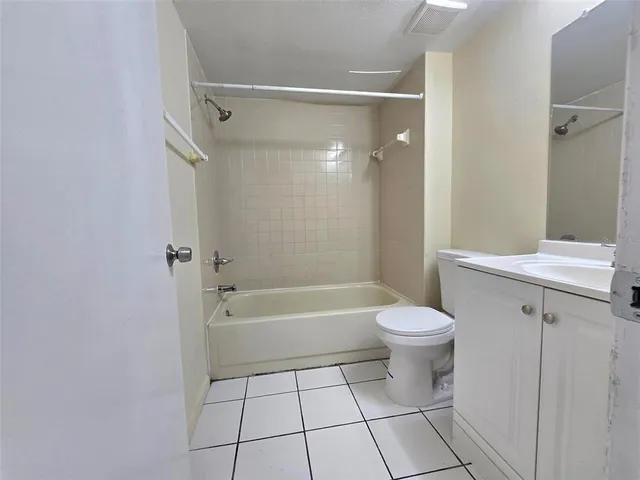 a bathroom with a toilet a sink and shower