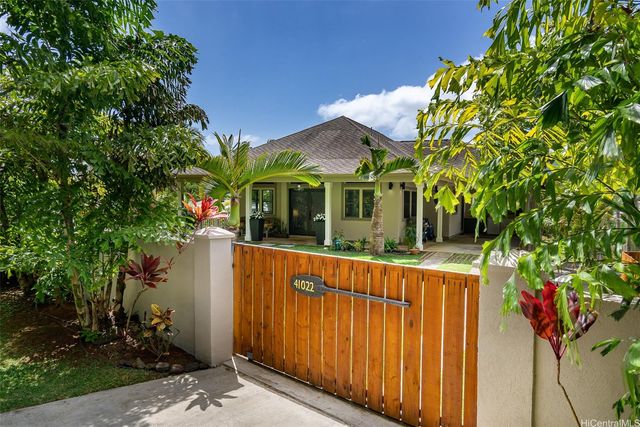 a view of a house with a tree