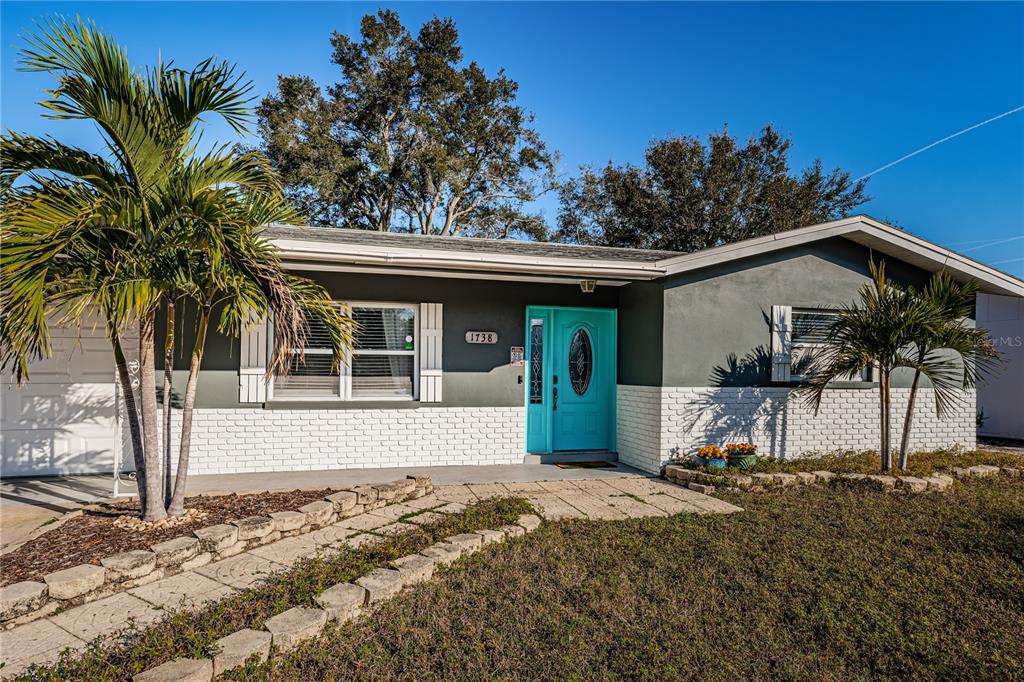 a view of a house with a backyard and windows