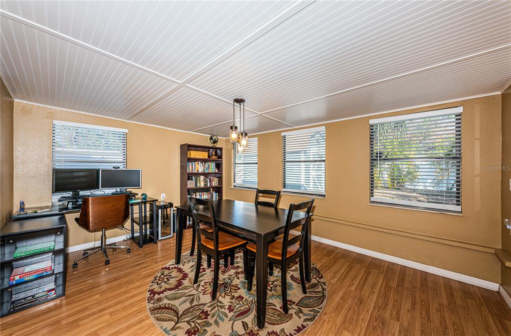 1738 Bentley Street Clearwater, FL 33755 - Photo 14 of 30 a view of a dining room with furniture and wooden floor