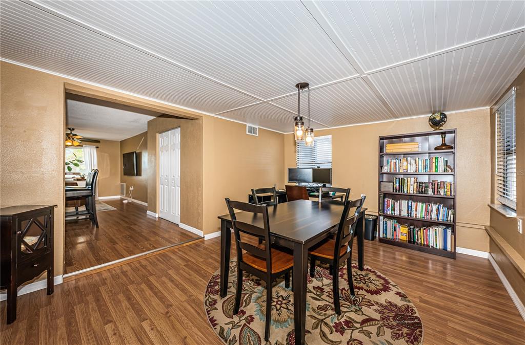 1738 Bentley Street Clearwater, FL 33755 - Photo 15 of 30 a view of a dining room with furniture and wooden floor