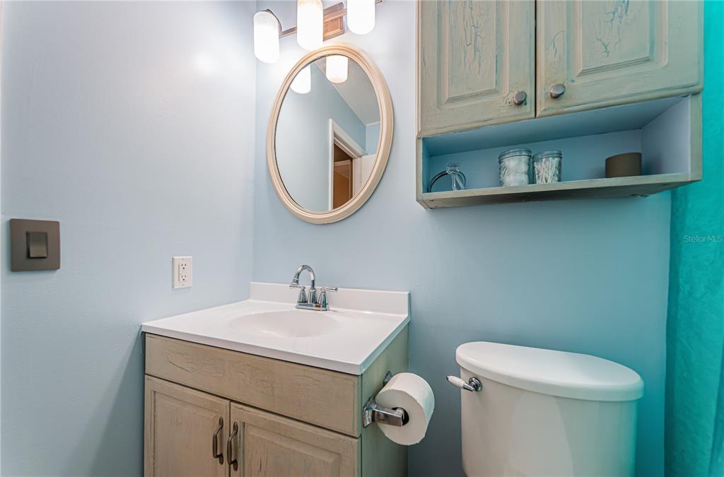 1738 Bentley Street Clearwater, FL 33755 - Photo 20 of 30 a bathroom with a toilet and a sink