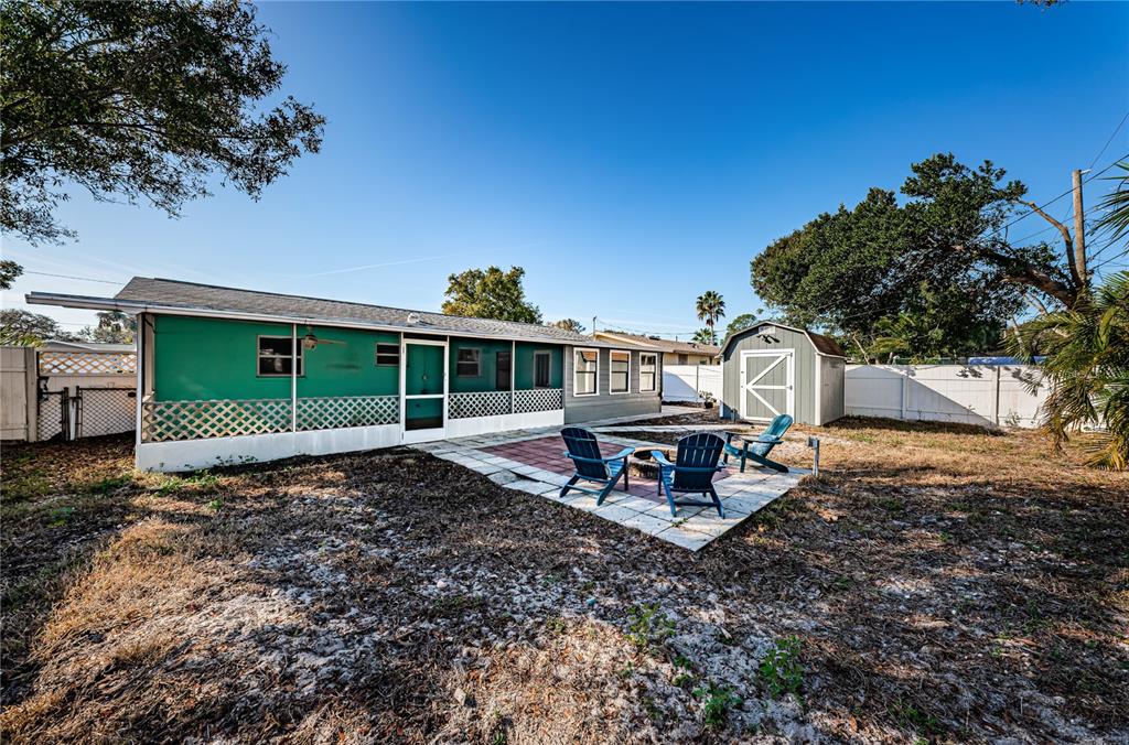 1738 Bentley Street Clearwater, FL 33755 - Photo 27 of 30 a view of a sitting area with some trees in the background