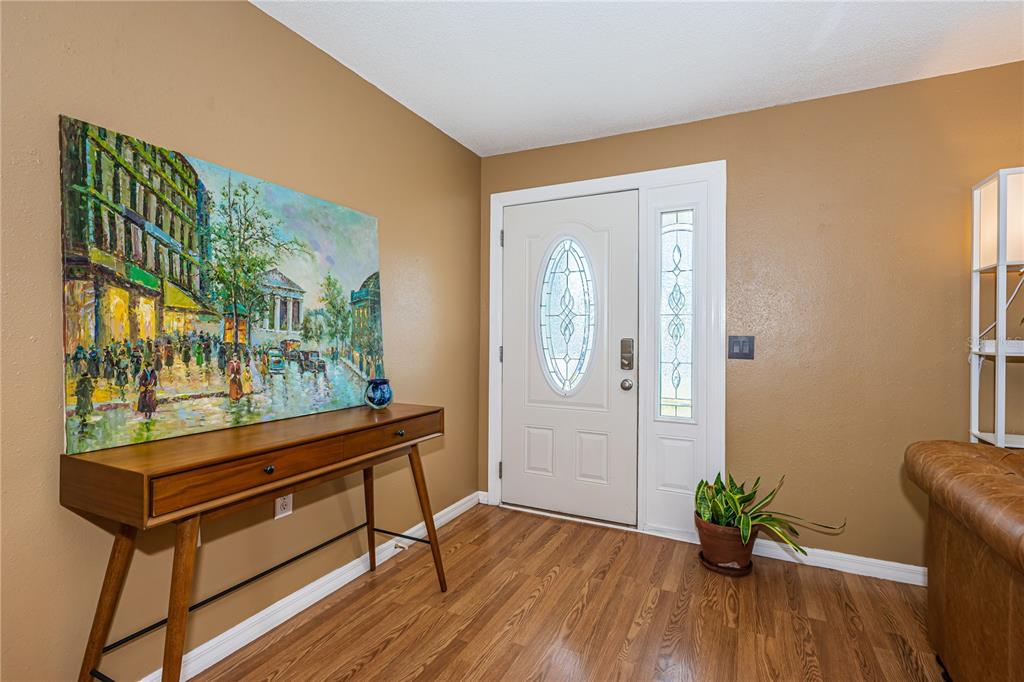 1738 Bentley Street Clearwater, FL 33755 - Photo 3 of 30 a sitting area with furniture and wooden floor
