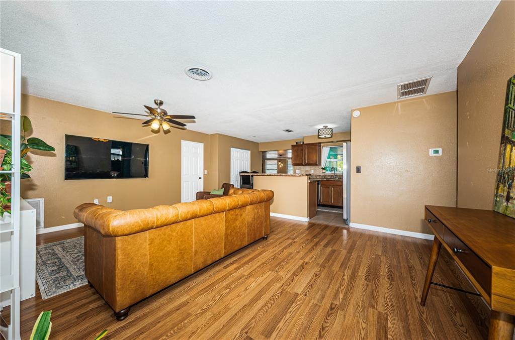 1738 Bentley Street Clearwater, FL 33755 - Photo 4 of 30 a living room with furniture and a flat screen tv