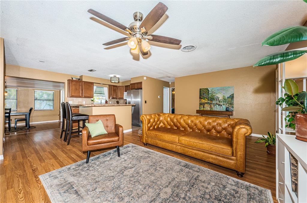 1738 Bentley Street Clearwater, FL 33755 - Photo 7 of 30 a living room with furniture and wooden floor