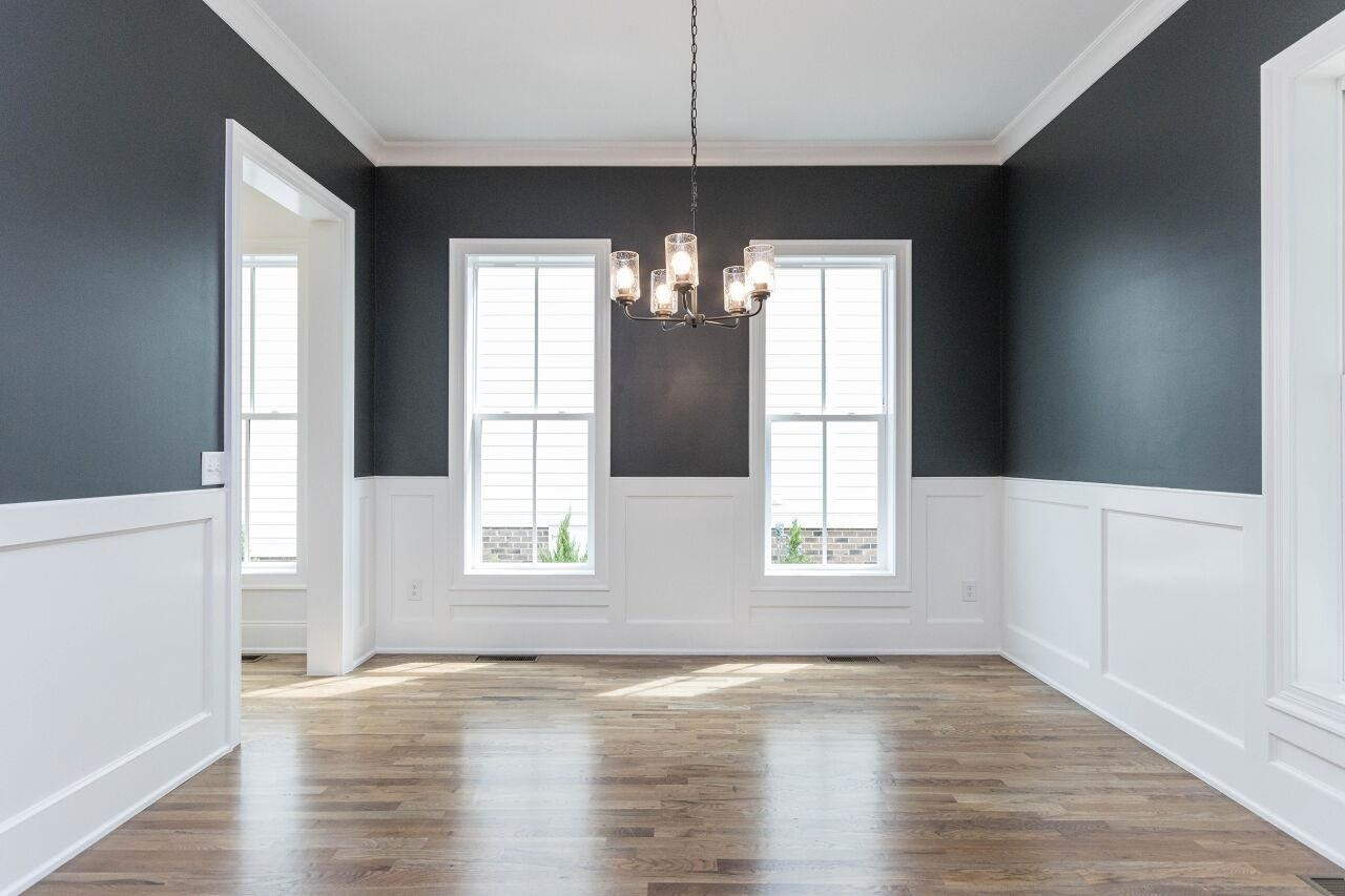 1108 Kentlands Drive Durham, NC 27713 - Photo 11 of 49 a view of an empty room with wooden floor and a window