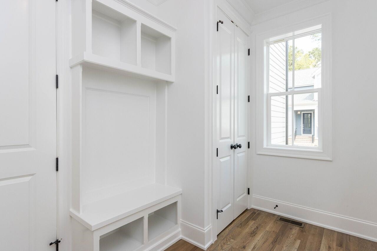 1108 Kentlands Drive Durham, NC 27713 - Photo 14 of 49 a view of an empty room with wooden floor and a window