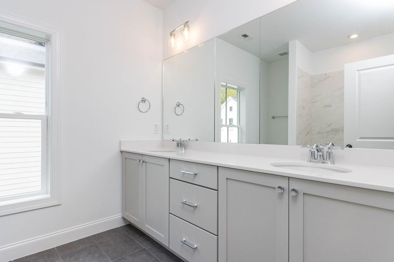 1108 Kentlands Drive Durham, NC 27713 - Photo 17 of 49 a bathroom with a granite countertop sink mirror and double