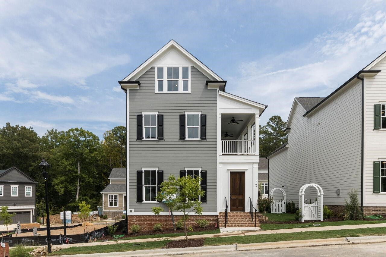1108 Kentlands Drive Durham, NC 27713 - Photo 2 of 49 a front view of a house with a yard