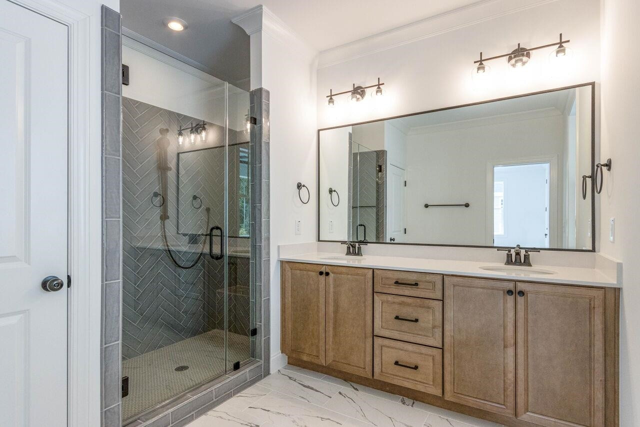 1108 Kentlands Drive Durham, NC 27713 - Photo 28 of 49 a bathroom with a granite countertop sink mirror and shower