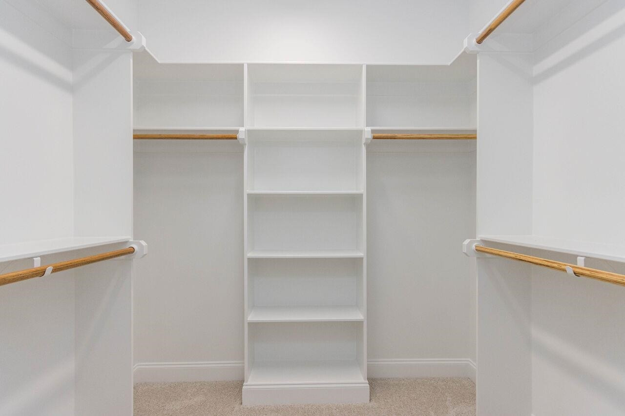 1108 Kentlands Drive Durham, NC 27713 - Photo 30 of 49 a view of walk in closet with empty racks