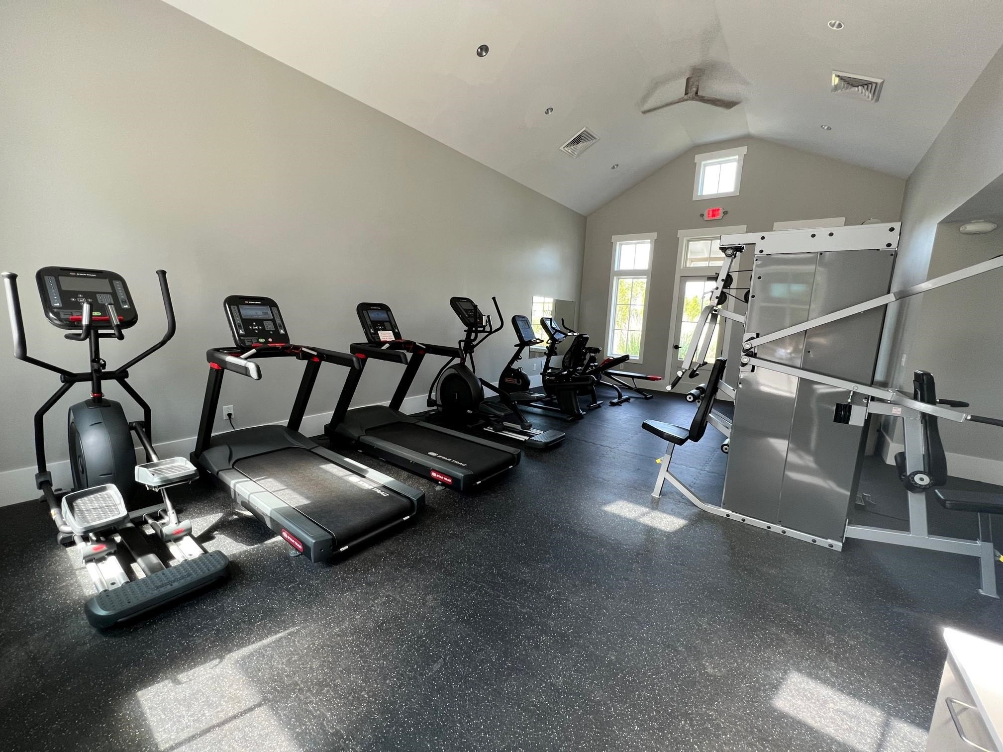 1108 Kentlands Drive Durham, NC 27713 - Photo 42 of 49 a room with gym equipment and a mirror