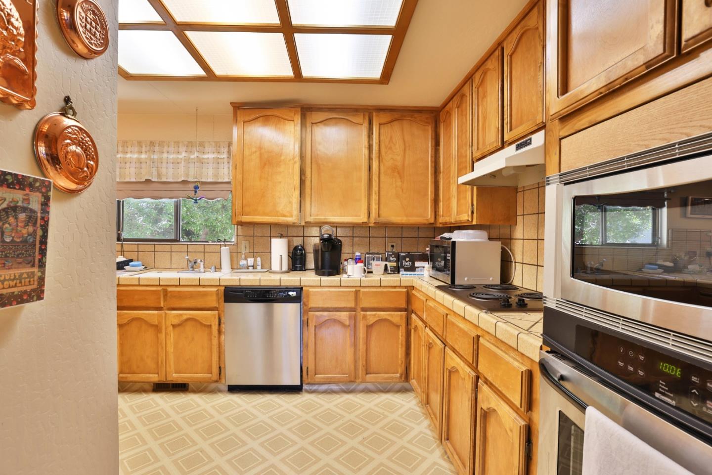 15 Rays Circle Hollister, CA 95023 - Photo 11 of 41 a kitchen with stainless steel appliances granite countertop a stove and a sink