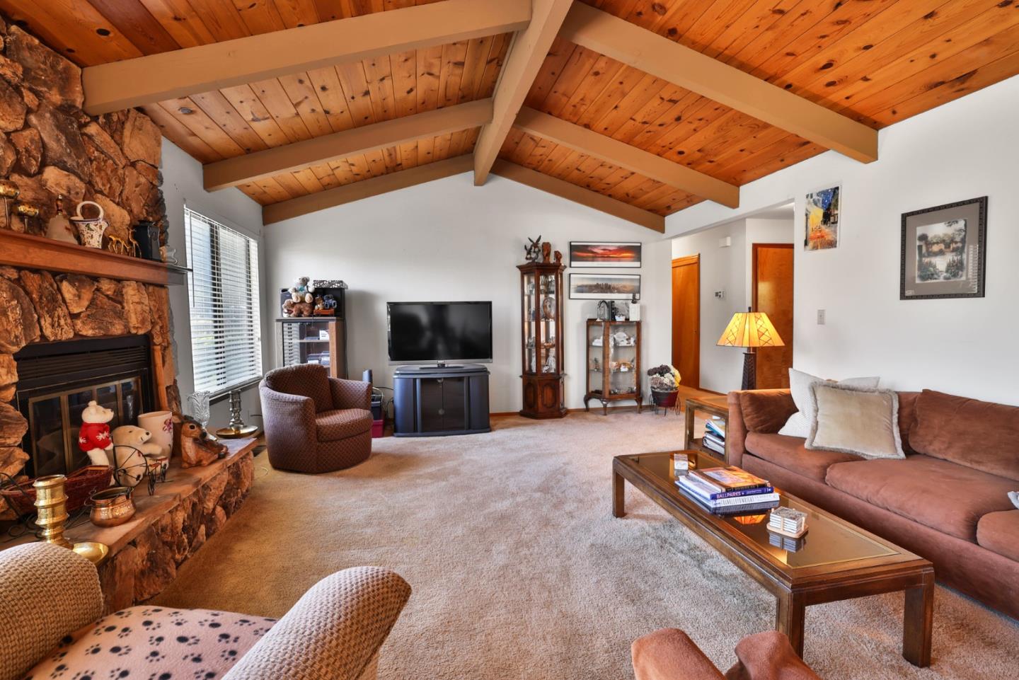 15 Rays Circle Hollister, CA 95023 - Photo 15 of 41 a living room with furniture a flat screen tv and a fireplace