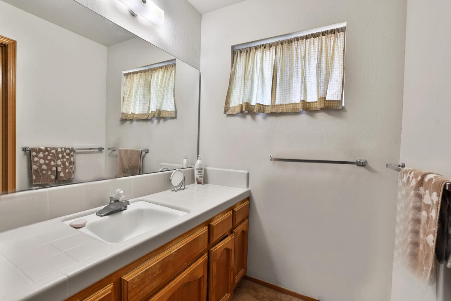 15 Rays Circle Hollister, CA 95023 - Photo 18 of 41 a bathroom with a sink and a mirror