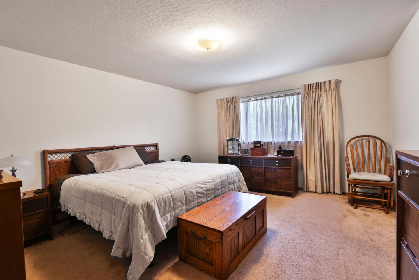 15 Rays Circle Hollister, CA 95023 - Photo 19 of 41 a bedroom with a bed and a dresser