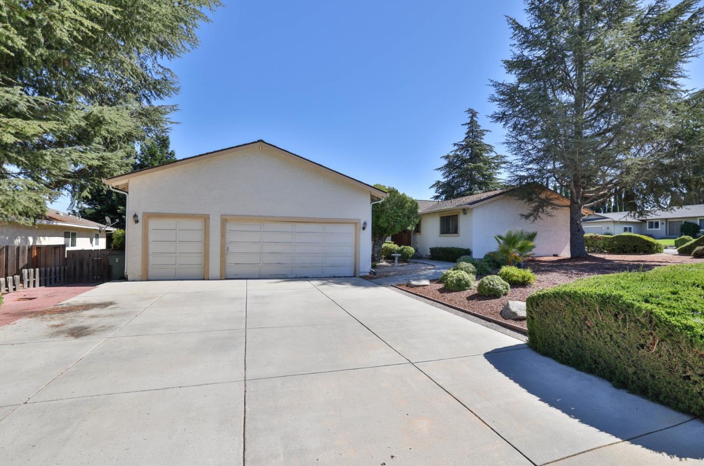 15 Rays Circle Hollister, CA 95023 - Photo 2 of 41 a front view of a house with a yard and garage