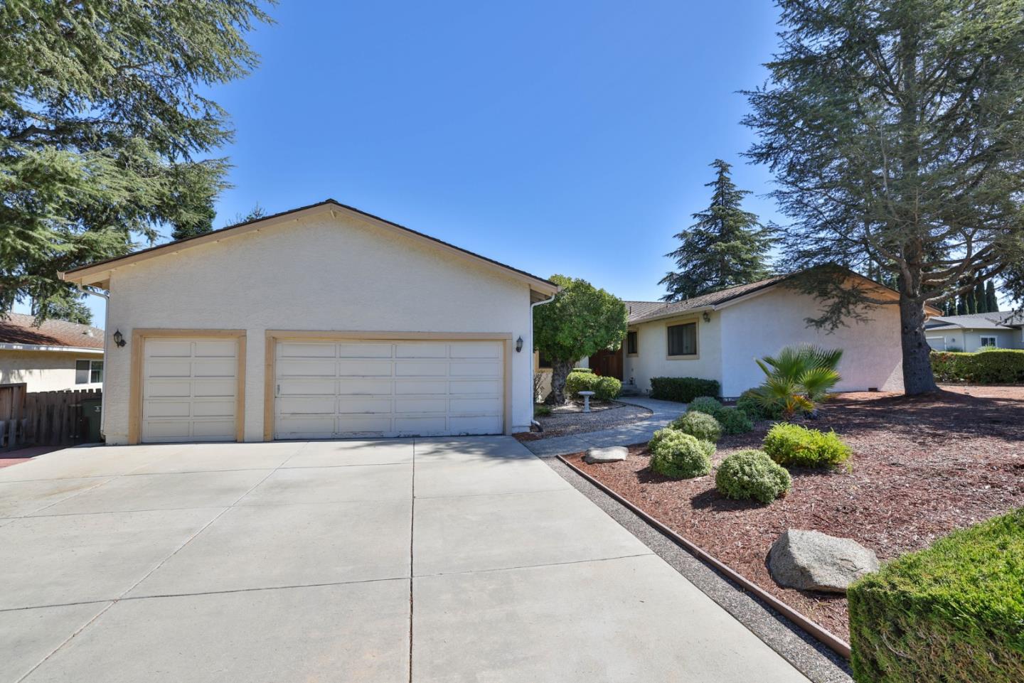 15 Rays Circle Hollister, CA 95023 - Photo 4 of 41 a front view of a house with a yard and potted plants