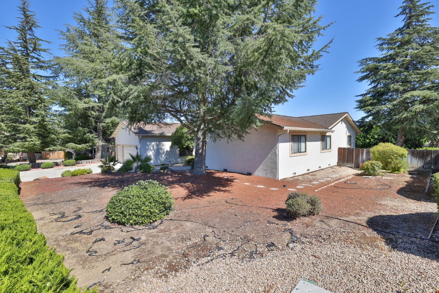 15 Rays Circle Hollister, CA 95023 - Photo 6 of 41 a front view of a house with a yard and garage