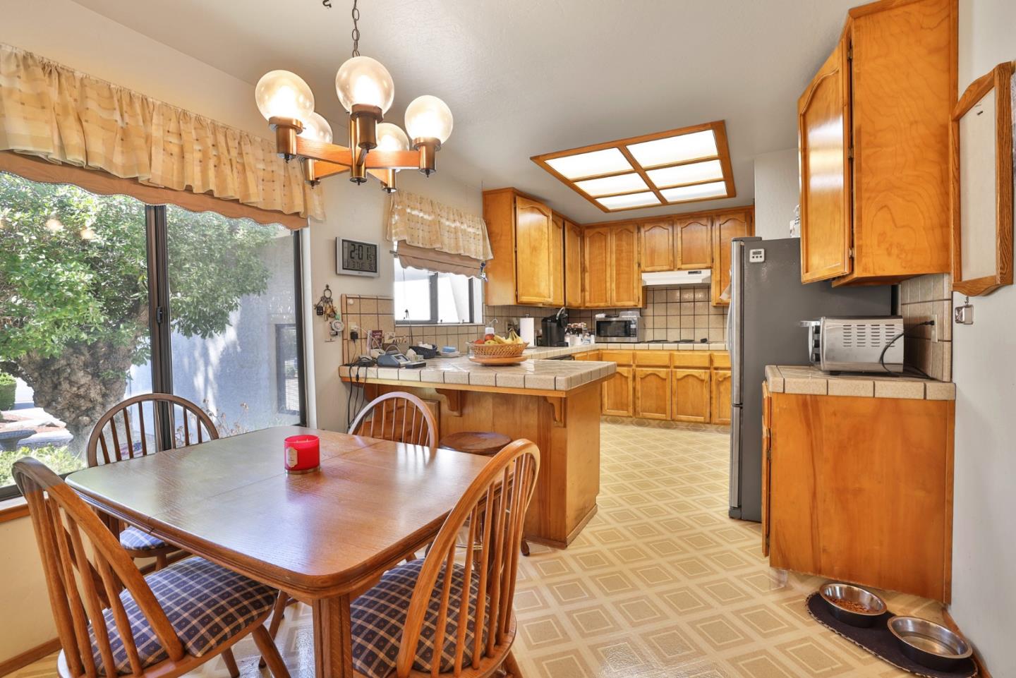 15 Rays Circle Hollister, CA 95023 - Photo 7 of 41 a dining room filled with large windows