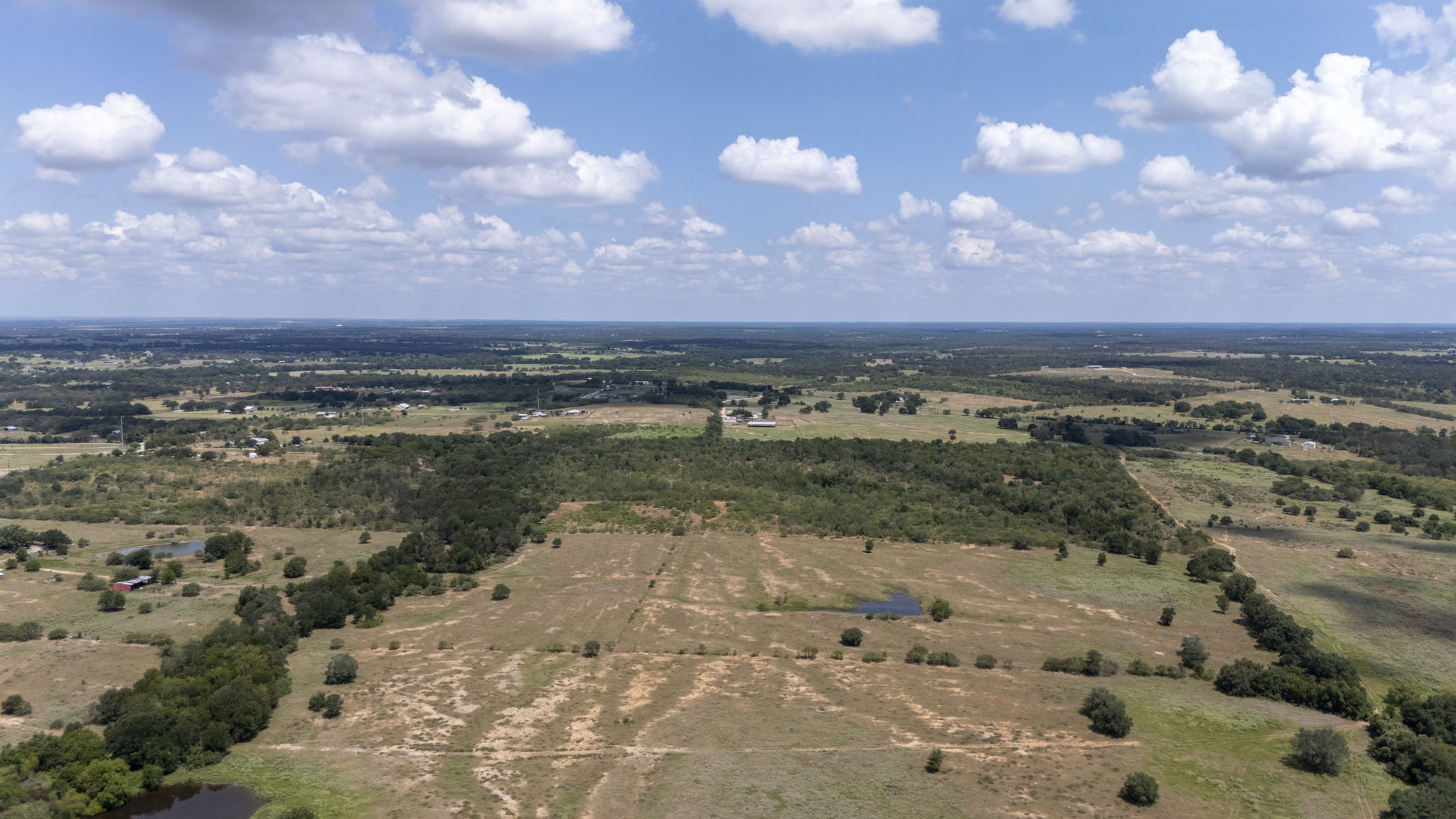 Tbd Fox Lane Lockhart, TX 78644 - Photo 12 of 35 a view of a lake with houses in back